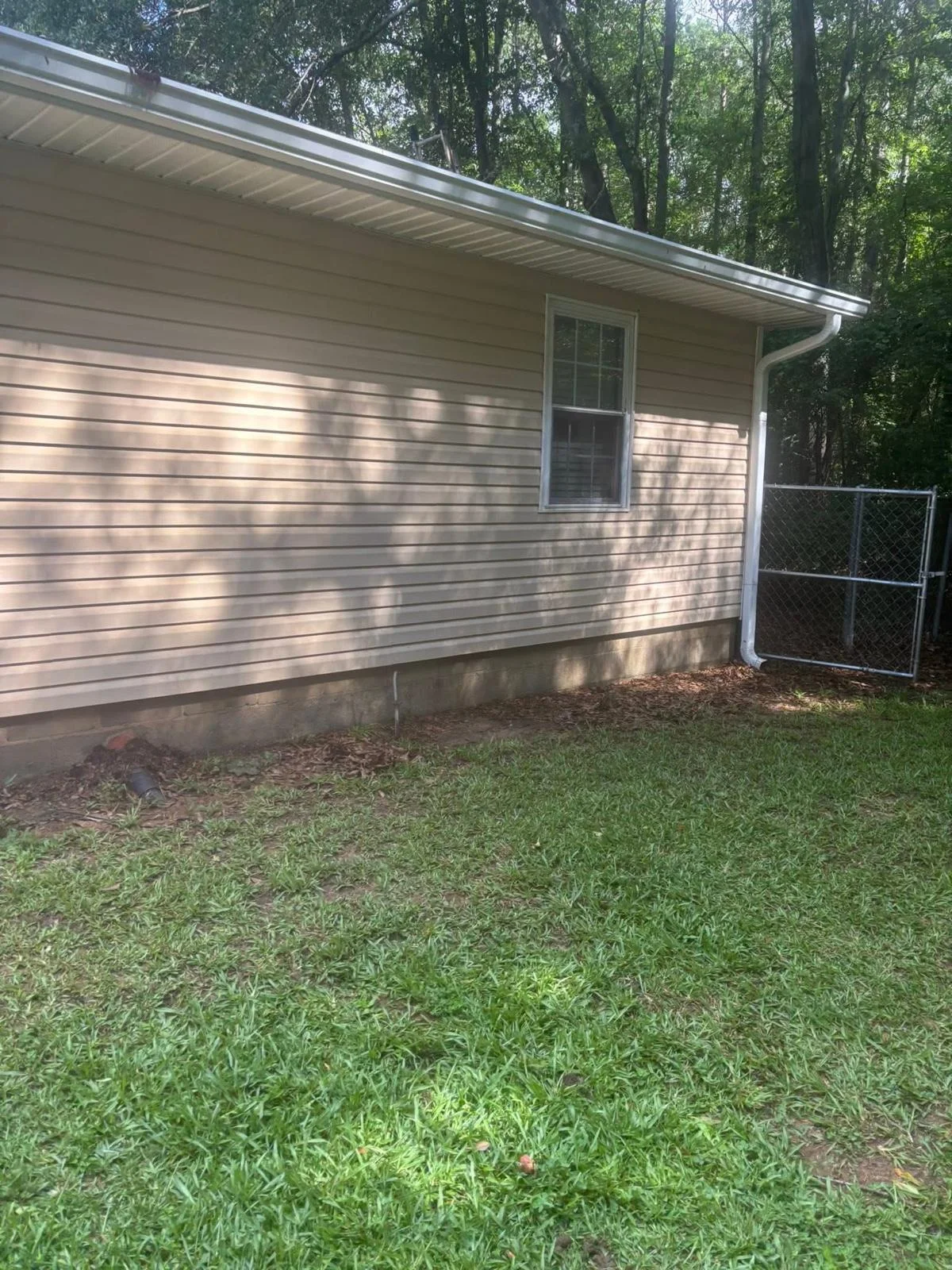 Clean house exterior after soft washing